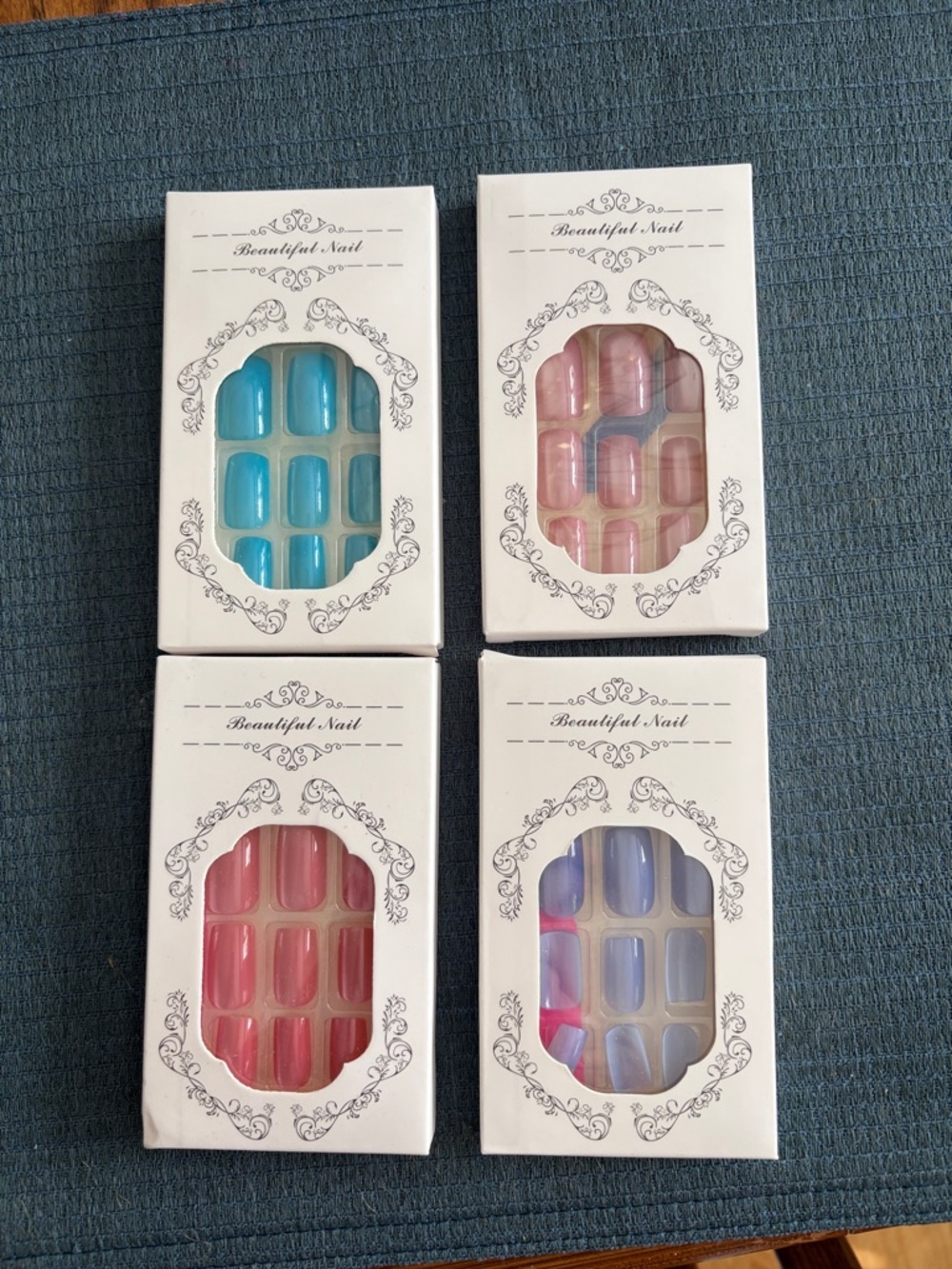 Press-On Nails Set - One Blue, Pink, Choral, Lavender. Not Sold Separately!
.